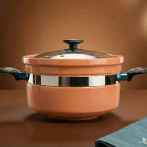 Ceramic pot with lid on a brown background