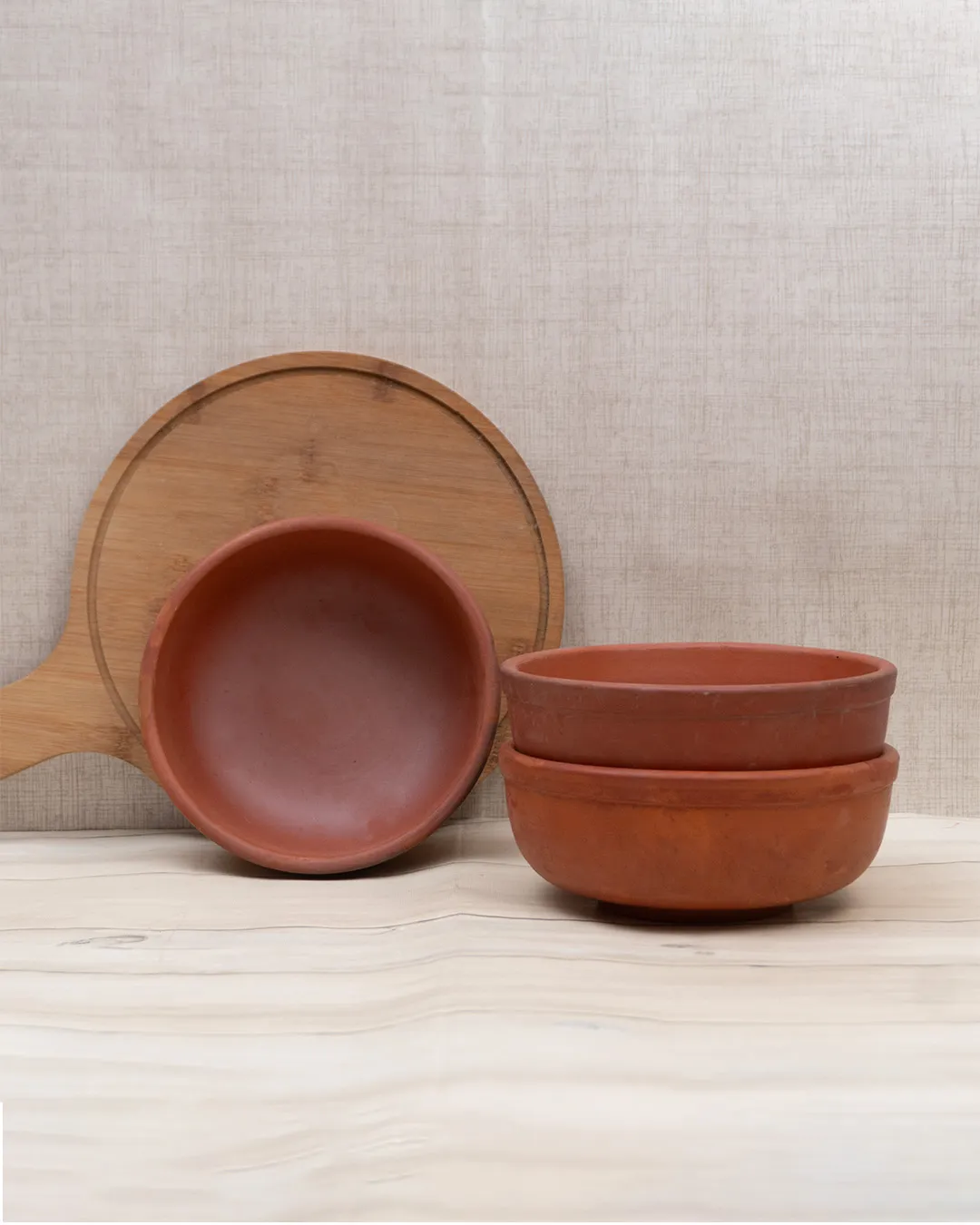 Handcrafted Clay Bowls (3 Pieces) made from natural terracotta for serving food.