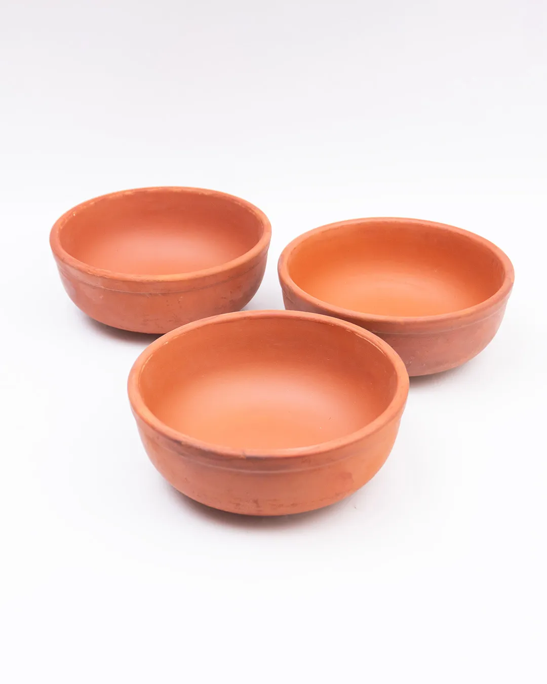 Handcrafted Clay Bowls (3 Pieces) made from natural terracotta for serving food.