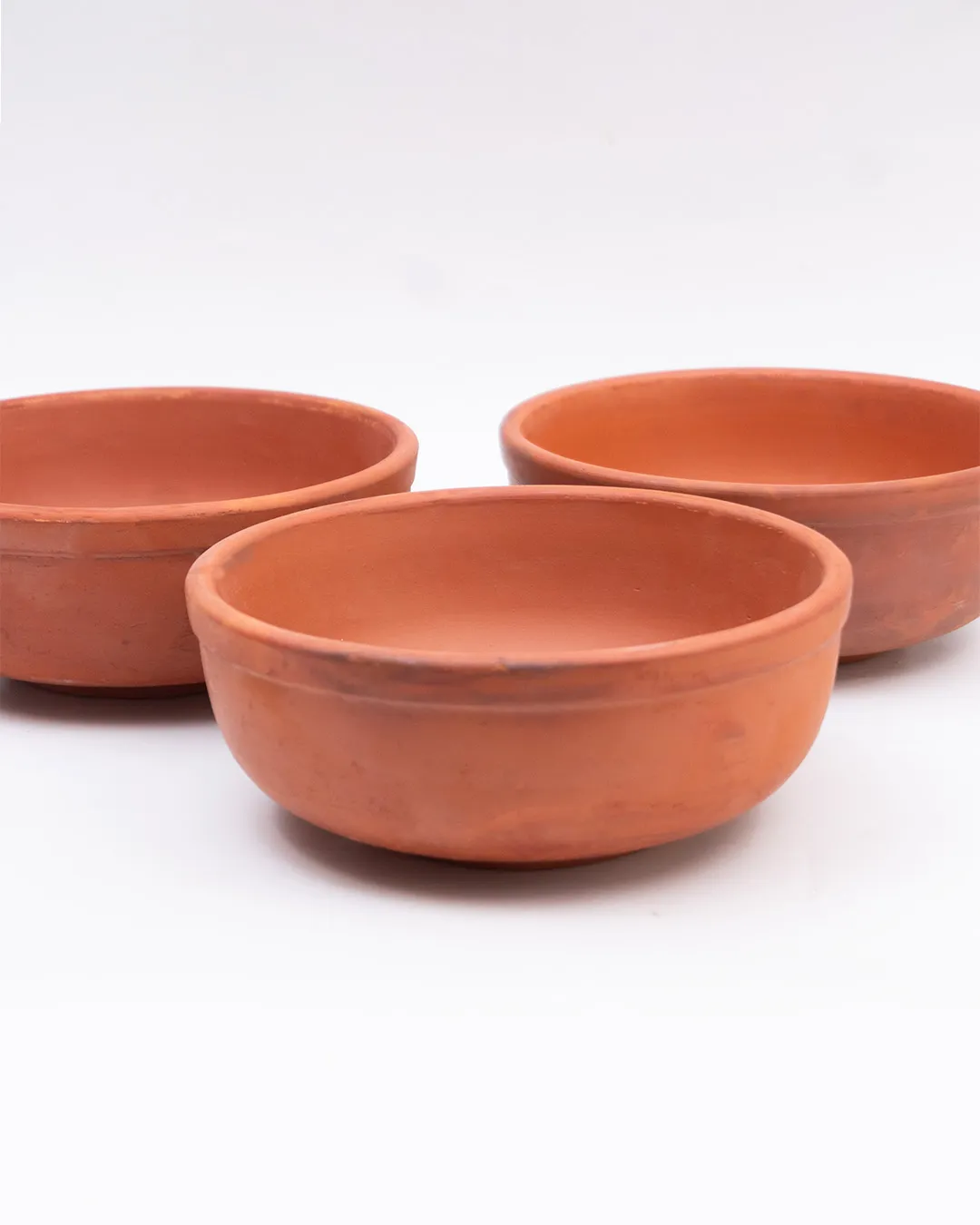 Handcrafted Clay Bowls (3 Pieces) made from natural terracotta for serving food.